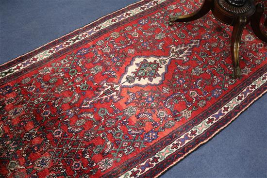 A Hamadan red ground runner, 10ft 2in by 3ft 6in.